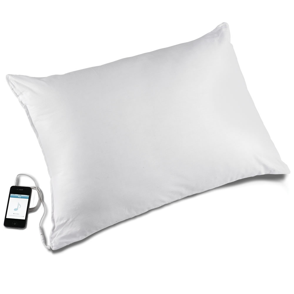 Pillow with outlet built in speaker