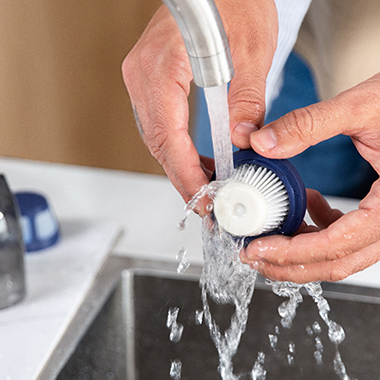 The Handheld Rechargeable Power Scrubber - Hammacher Schlemmer