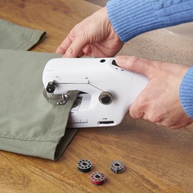 The Cordless Handheld Sewing Machine - Hammacher Schlemmer