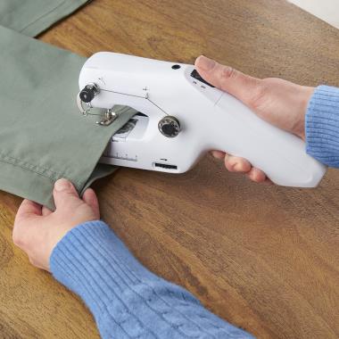 The Cordless Handheld Sewing Machine - Hammacher Schlemmer